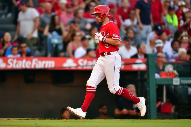 Jul 19, 2023; Anaheim, California, USA; Los Angeles Angels shortstop Zach Neto (9) reaches home to score against the New York Yankees during the eighth inning at Angel Stadium. Mandatory Credit: Gary A. Vasquez-USA TODAY Sports