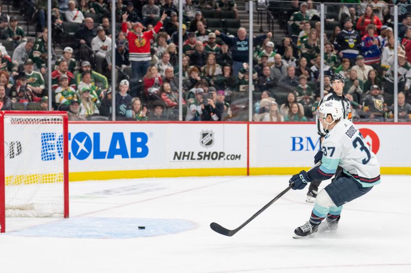 Apr 18, 2024; Saint Paul, Minnesota, USA; Seattle Kraken center Yanni Gourde (37) scores a goal against the Minnesota Wild in the third period at Xcel Energy Center. Mandatory Credit: Matt Blewett-USA TODAY Sports