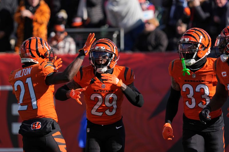 Cincinnati Bengals cornerback Cam Taylor-Britt (29) celebrates with teammates after returning an interception for a touchdown during the first half of an NFL football game against the Pittsburgh Steelers, Sunday, Dec. 1, 2024, in Cincinnati. (AP Photo/Joshua A. Bickel)