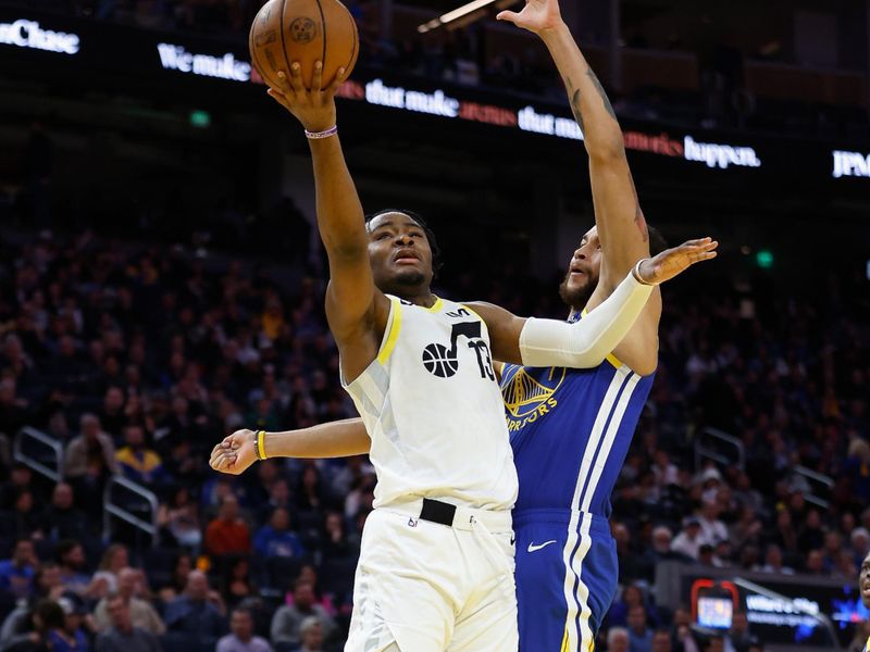 SAN FRANCISCO, CALIFORNIA - JANUARY 28: Isaiah Collier #13 of the Utah Jazz goes to the basket against Kyle Anderson #1 of the Golden State Warriors in the fourth quarter at Chase Center on January 28, 2025 in San Francisco, California. NOTE TO USER: User expressly acknowledges and agrees that, by downloading and or using this photograph, User is consenting to the terms and conditions of the Getty Images License Agreement. (Photo by Lachlan Cunningham/Getty Images)