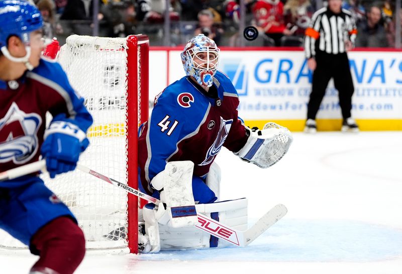 Mar 4, 2025; Denver, Colorado, USA; Colorado Avalanche goaltender Scott Wedgewood (41) tracks a loose puck in the third period against the Pittsburgh Penguins at Ball Arena. Mandatory Credit: Ron Chenoy-Imagn Images