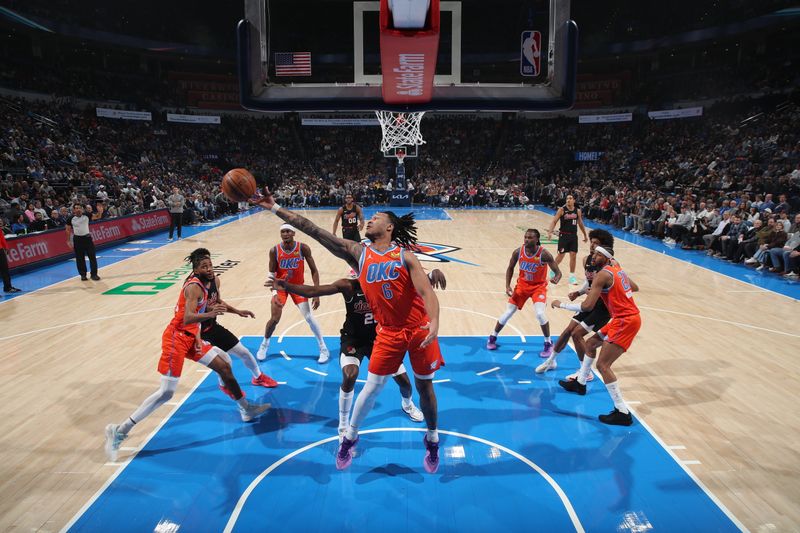 OKLAHOMA CITY, OK - JANUARY 23: Jaylin Williams #6 of the Oklahoma City Thunder grabs the rebound during the game against the Portland Trail Blazers on January 23, 2024 at Paycom Arena in Oklahoma City, Oklahoma. NOTE TO USER: User expressly acknowledges and agrees that, by downloading and or using this photograph, User is consenting to the terms and conditions of the Getty Images License Agreement. Mandatory Copyright Notice: Copyright 2024 NBAE (Photo by Zach Beeker/NBAE via Getty Images)