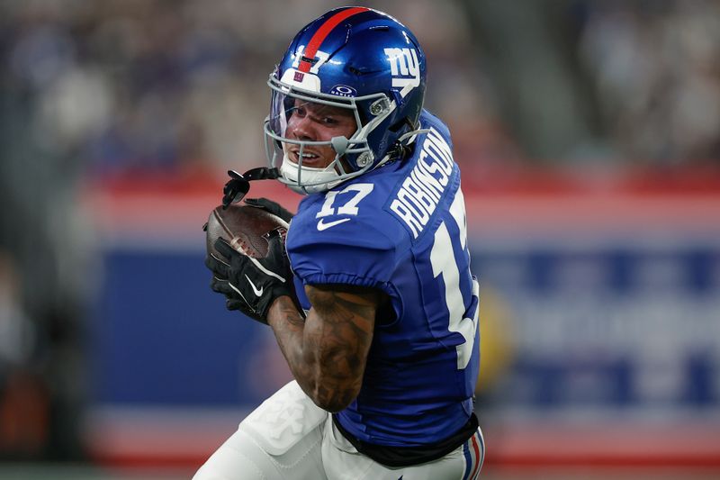 New York Giants wide receiver Wan'Dale Robinson (17) makes a catch against the Dallas Cowboys during the first quarter of an NFL football game, Thursday, Sept. 26, 2024, in East Rutherford, N.J. (AP Photo/Adam Hunger)