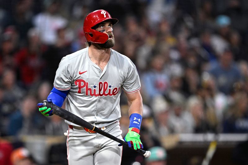 Apr 26, 2024; San Diego, California, USA; Philadelphia Phillies first baseman Bryce Harper (3) hits a home run against the San Diego Padres during the third inning at Petco Park. Mandatory Credit: Orlando Ramirez-USA TODAY Sports