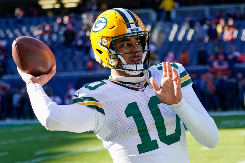 Green Bay Packers' Jordan Love warms up before an NFL football game against the Chicago Bears Sunday, Dec. 4, 2022, in Chicago. (AP Photo/Charles Rex Arbogast)