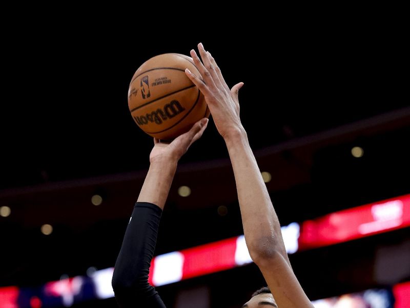 HOUSTON, TEXAS - DECEMBER 11: Victor Wembanyama #1 of the San Antonio Spurs warms up prior to facing the Houston Rockets at Toyota Center on December 11, 2023 in Houston, Texas. NOTE TO USER: User expressly acknowledges and agrees that, by downloading and or using this photograph, User is consenting to the terms and conditions of the Getty Images License Agreement.? (Photo by Carmen Mandato/Getty Images)