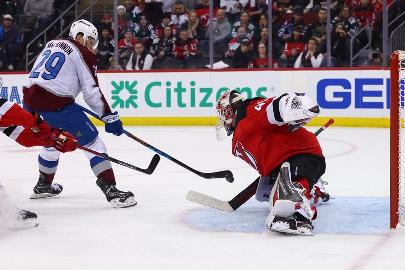 Feb 6, 2024; Newark, New Jersey, USA; Colorado Avalanche center Nathan MacKinnon (29) is stopped by New Jersey Devils goaltender Vitek Vanecek (41) during the third period at Prudential Center. Mandatory Credit: Ed Mulholland-USA TODAY Sports