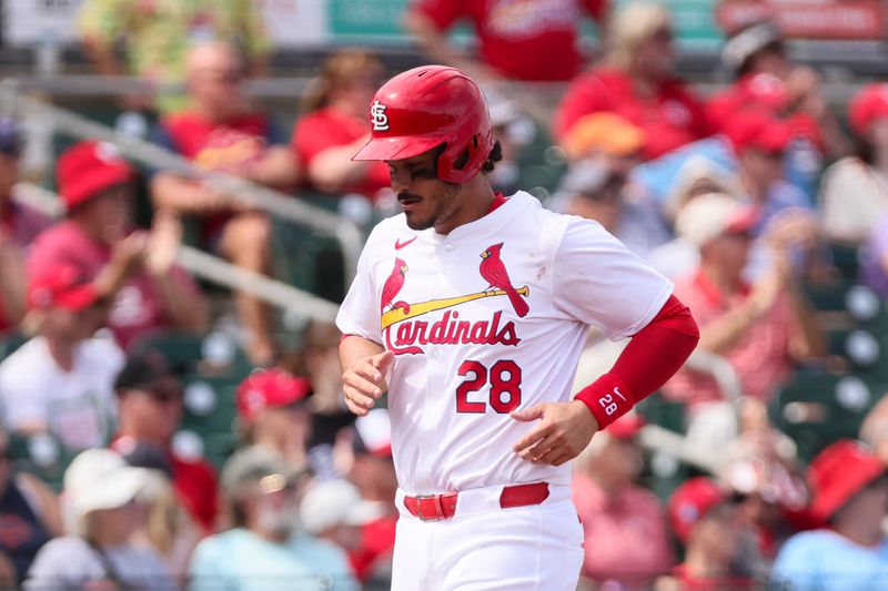 Mar 5, 2024; Jupiter, Florida, USA; St. Louis Cardinals third baseman Nolan Arenado (28) scores against the Minnesota Twins during the third inning at Roger Dean Chevrolet Stadium. Mandatory Credit: Sam Navarro-USA TODAY Sports