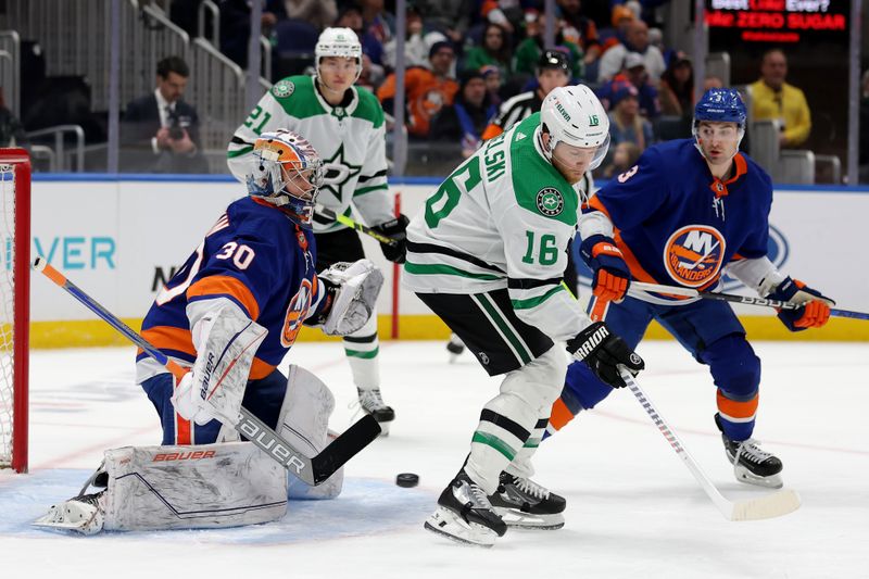 Jan 21, 2024; Elmont, New York, USA; Dallas Stars center Joe Pavelski (16) plays the puck against New York Islanders goaltender Ilya Sorokin (30) and defenseman Adam Pelech (3) during the first period at UBS Arena. Mandatory Credit: Brad Penner-USA TODAY Sports