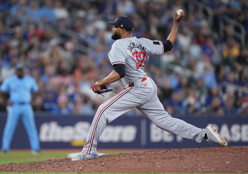 May 11, 2024; Toronto, Ontario, CAN; Minnesota Twins relief pitcher Jay Jackson (32) throws a pitch against the Toronto Blue Jays during the seventh inning at Rogers Centre. Mandatory Credit: Nick Turchiaro-USA TODAY Sports