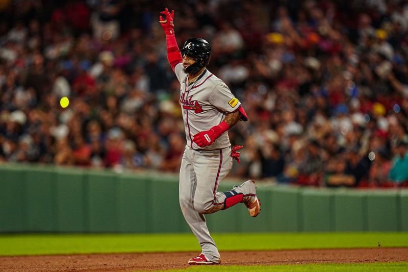 Jun 4, 2024; Boston, Massachusetts, USA; Atlanta Braves shortstop Orlando Arcia (11) hits a home run against the Boston Red Sox in the seventh inning at Fenway Park. Mandatory Credit: David Butler II-USA TODAY Sports