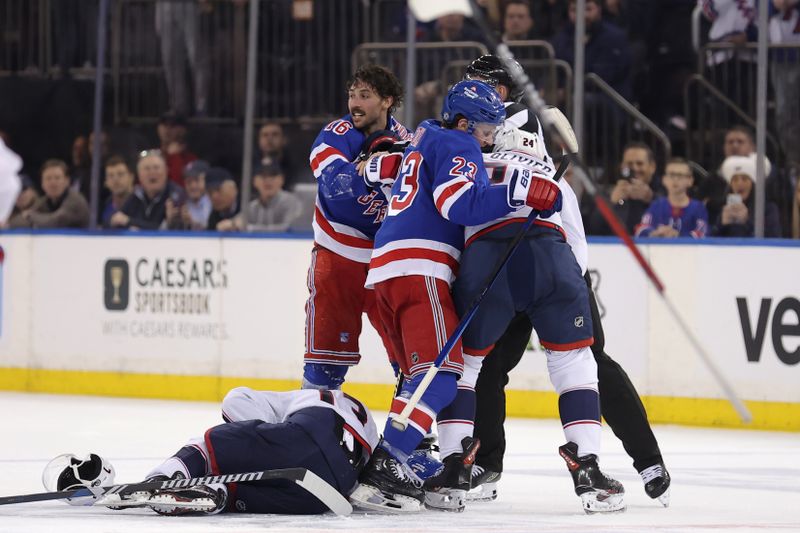 Feb 28, 2024; New York, New York, USA; New York Rangers center Vincent Trocheck (16) and defenseman Adam Fox (23) argue with Columbus Blue Jackets right wing Mathieu Olivier (24) after Trocheck hit Blue Jackets left wing Johnny Gaudreau (bottom) during the second period at Madison Square Garden. Mandatory Credit: Brad Penner-USA TODAY Sports