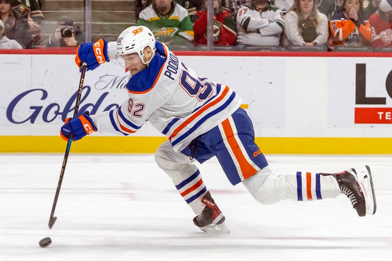 Jan 15, 2025; Saint Paul, Minnesota, USA;  Edmonton Oilers forward Vasily Podkolzin (92) takes a shot on goal against the Minnesota Wild during the third period at Xcel Energy Center. Mandatory Credit: Nick Wosika-Imagn Images

