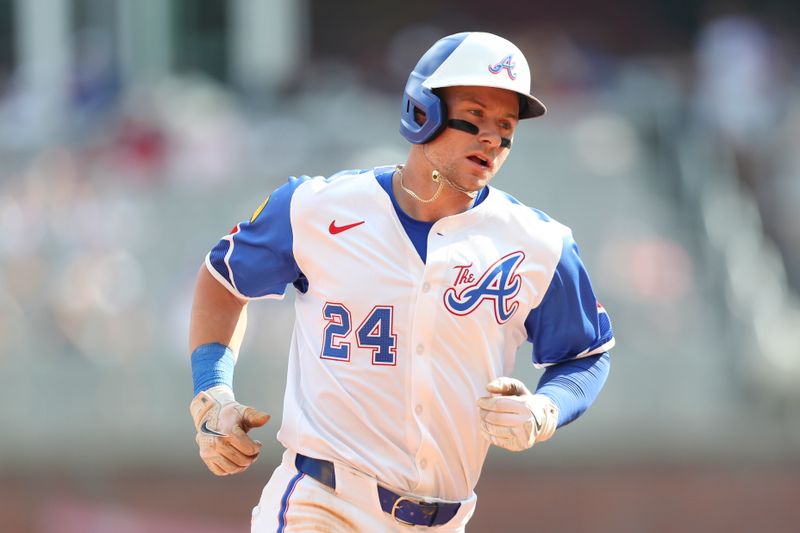 Jun 15, 2024; Cumberland, Georgia, USA; Atlanta Braves left fielder Jarred Kelenic (24) hits a home run against the Tampa Bay Rays during the fifth inning at Truist Park. Mandatory Credit: Mady Mertens-USA TODAY Sports