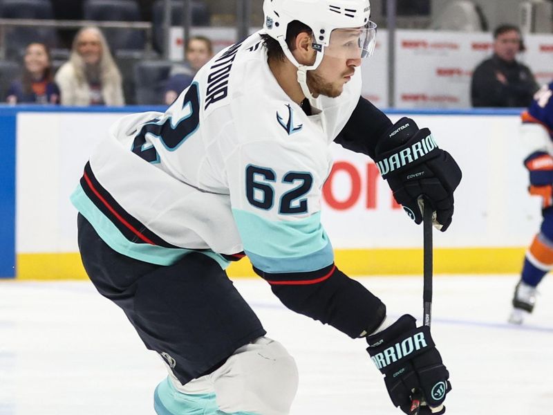 Nov 23, 2025; Elmont, New York, USA;  Seattle Kraken defenseman Brandon Montour (62) controls the puck in the first period against the New York Islanders at UBS Arena. Mandatory Credit: Wendell Cruz-Imagn Images