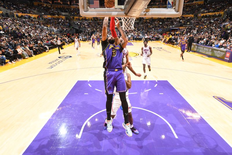 LOS ANGELES, CA - MARCH 22: Anthony Davis #3 of the Los Angeles Lakers drives to the basket during the game against the Philadelphia 76ers on March 22, 2024 at Crypto.Com Arena in Los Angeles, California. NOTE TO USER: User expressly acknowledges and agrees that, by downloading and/or using this Photograph, user is consenting to the terms and conditions of the Getty Images License Agreement. Mandatory Copyright Notice: Copyright 2024 NBAE (Photo by Adam Pantozzi/NBAE via Getty Images)