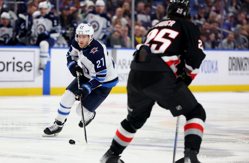 Mar 3, 2024; Buffalo, New York, USA;  Winnipeg Jets left wing Nikolaj Ehlers (27) skates up ice with the puck during the third period against the Buffalo Sabres at KeyBank Center. Mandatory Credit: Timothy T. Ludwig-USA TODAY Sports