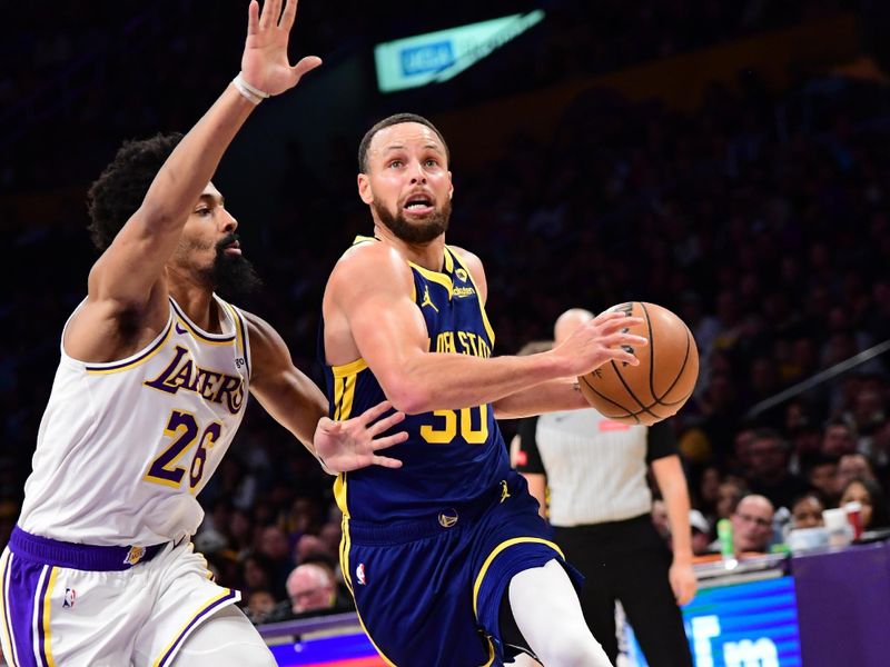 LOS ANGELES, CA - MACH 16: Stephen Curry #30 of the Golden State Warriors drives to the basket during the game against the Los Angeles Lakers on March 16, 2024 at Crypto.Com Arena in Los Angeles, California. NOTE TO USER: User expressly acknowledges and agrees that, by downloading and/or using this Photograph, user is consenting to the terms and conditions of the Getty Images License Agreement. Mandatory Copyright Notice: Copyright 2024 NBAE (Photo by Adam Pantozzi/NBAE via Getty Images)