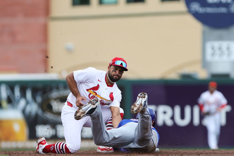 Mar 1, 2024; Jupiter, Florida, USA; St. Louis Cardinals second baseman Jose Fermin (15) tags out New York Mets center fielder Trayce Thompson (43) during the second inning at Roger Dean Chevrolet Stadium. Mandatory Credit: Sam Navarro-USA TODAY Sports