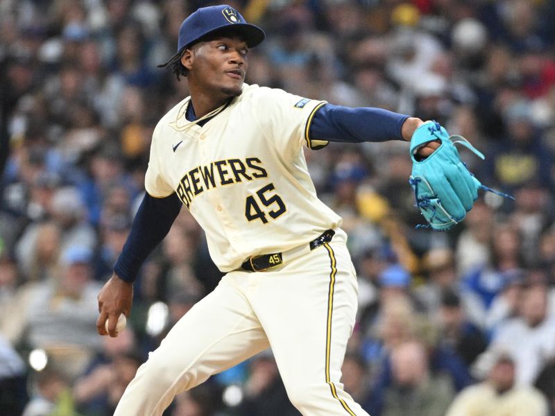 Apr 28, 2024; Milwaukee, Wisconsin, USA; Milwaukee Brewers pitcher Abner Uribe (45) delivers a pitch against the New York Yankees in the sixth inning against the New York Yankees at American Family Field. Mandatory Credit: Michael McLoone-USA TODAY Sports