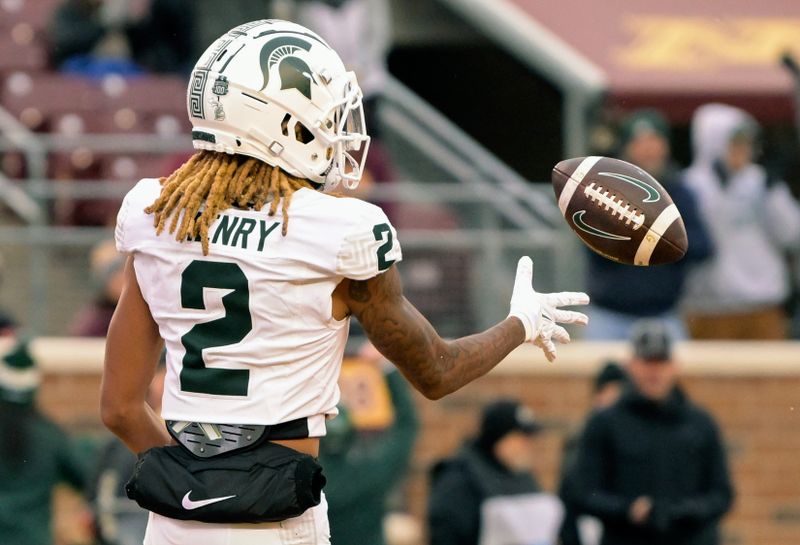 Oct 28, 2023; Minneapolis, Minnesota, USA;  Michigan State Spartans wide receiver Tyrell Henry (2) tosses the ball to a teammate after scoring a touchdown against the Minnesota Golden Gophers during the fourth quarter at Huntington Bank Stadium. Mandatory Credit: Nick Wosika-USA TODAY Sports