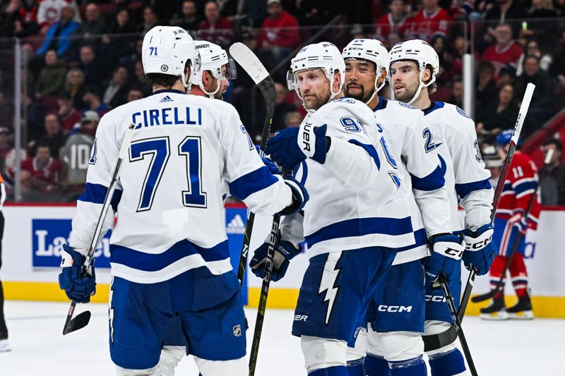 Apr 4, 2024; Montreal, Quebec, CAN; Tampa Bay Lightning center Steven Stamkos (91) celebrates his goal against the Montreal Canadiens with his teammates during the second period at Bell Centre. Mandatory Credit: David Kirouac-USA TODAY Sports