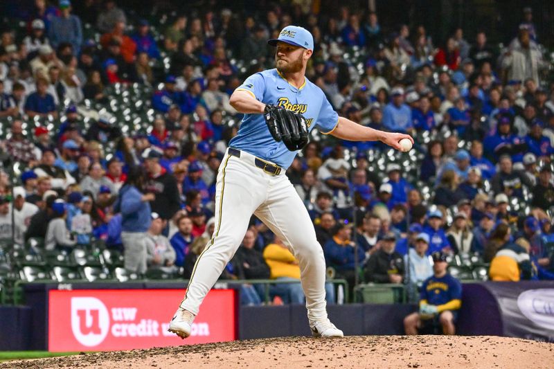 May 2, 2025; Milwaukee, Wisconsin, USA;  Milwaukee Brewers first baseman Jake Bauers (9) throws a pitch in the ninth inning against the Chicago Cubs at American Family Field. Mandatory Credit: Benny Sieu-Imagn Images
