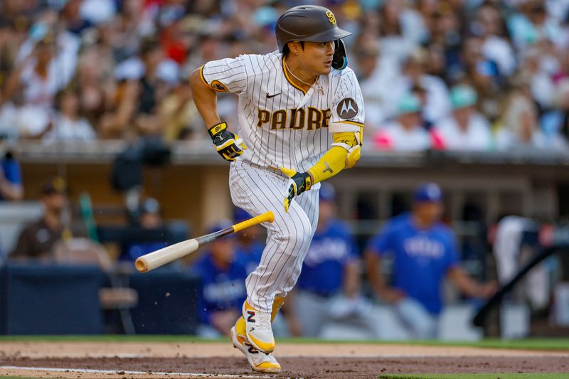 Jul 29, 2023; San Diego, California, USA;  San Diego Padres second baseman Ha-Seong Kim (7) runs to first base after hitting a RBI single during the second inning against the Texas Rangers at Petco Park at Petco Park. Mandatory Credit: David Frerker-USA TODAY Sports