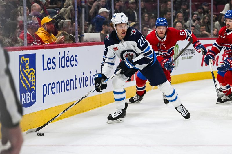 Oct 28, 2023; Montreal, Quebec, CAN; Winnipeg Jets center Mason Appleton (22) plays the puck against the Montreal Canadiens during the first period at Bell Centre. Mandatory Credit: David Kirouac-USA TODAY Sports