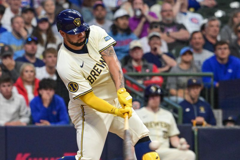 May 29, 2024; Milwaukee, Wisconsin, USA; Milwaukee Brewers designated hitter Gary Sanchez (99) hits a double to drive in two runs in the third inning against the Chicago Cubs at American Family Field. Mandatory Credit: Benny Sieu-USA TODAY Sports