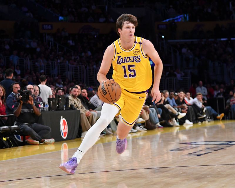 LOS ANGELES, CA - OCTOBER 22:  Austin Reaves #15 of the Los Angeles Lakers drives to the basket during the game against the Memphis Grizzlies on October 22, 2024 at Crypto.com Arena in Los Angeles, California. NOTE TO USER: User expressly acknowledges and agrees that, by downloading and/or using this Photograph, user is consenting to the terms and conditions of the Getty Images License Agreement. Mandatory Copyright Notice: Copyright 2024 NBAE (Photo by Juan Ocampo/NBAE via Getty Images)