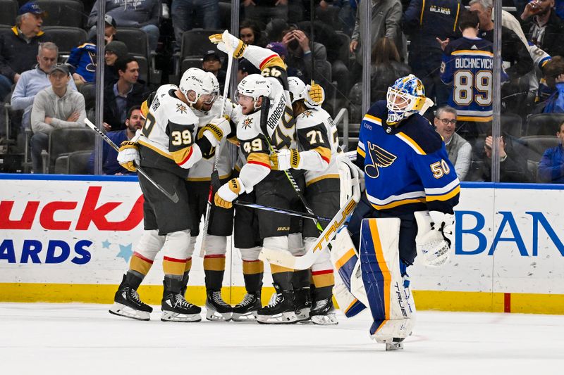 Mar 25, 2024; St. Louis, Missouri, USA;  Vegas Golden Knights right wing Jonathan Marchessault (81) is congratulated by teammates after scoring the game winning goal against goaltender Jordan Binnington (50) in overtime at Enterprise Center. Mandatory Credit: Jeff Curry-USA TODAY Sports