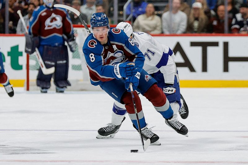 Nov 4, 2025; Denver, Colorado, USA; Colorado Avalanche defenseman Cale Makar (8) controls the puck ahead of Tampa Bay Lightning center Anthony Cirelli (71) in the second period at Ball Arena. Mandatory Credit: Isaiah J. Downing-Imagn Images