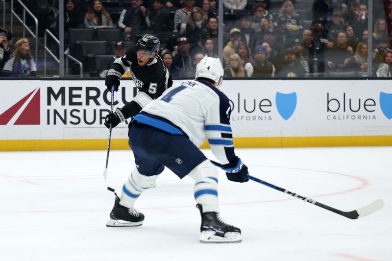 Nov 4, 2025; Los Angeles, California, USA;  Los Angeles Kings right wing Quinton Byfield (55) takes a slapshot during the second period against the Winnipeg Jets at Crypto.com Arena. Mandatory Credit: Kiyoshi Mio-Imagn Images