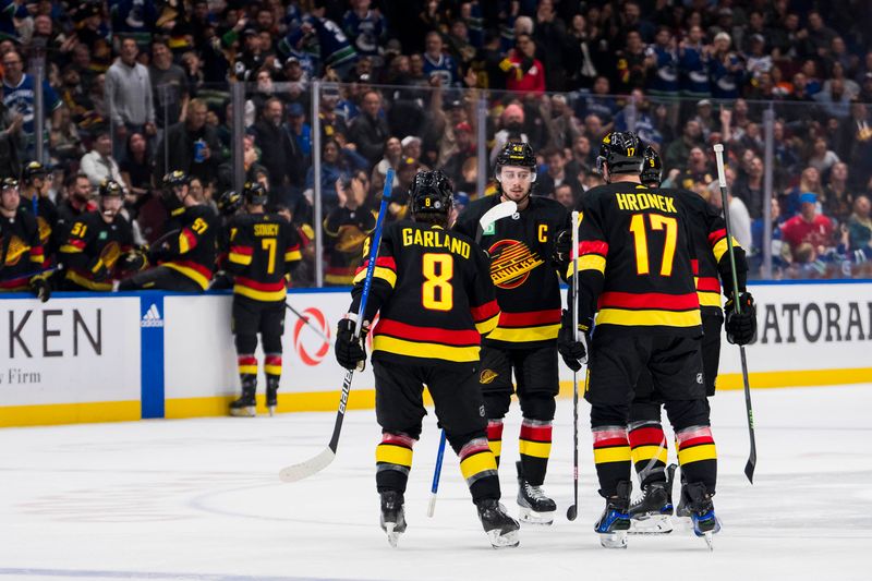 Nov 6, 2023; Vancouver, British Columbia, CAN; Vancouver Canucks defenseman Quinn Hughes (43), forward Conor Garland (8), defenseman Filip Hronek (17) and forward J.T. Miller (9) celebrate Miller   s goal against the Edmonton Oilers in the third period at Rogers Arena. Vancouver won 6-2. Mandatory Credit: Bob Frid-USA TODAY Sports