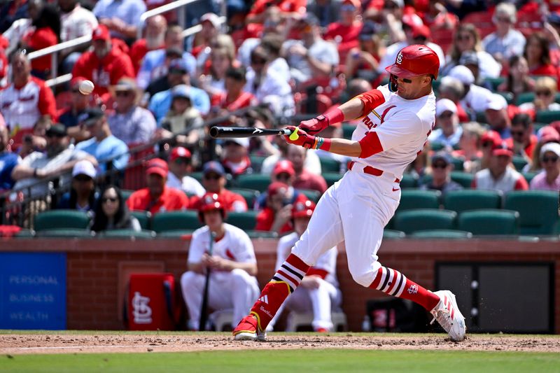 Apr 24, 2024; St. Louis, Missouri, USA;  St. Louis Cardinals left fielder Lars Nootbaar (21) hits a two run double against the Arizona Diamondbacks during the eighth inning at Busch Stadium. Mandatory Credit: Jeff Curry-USA TODAY Sports