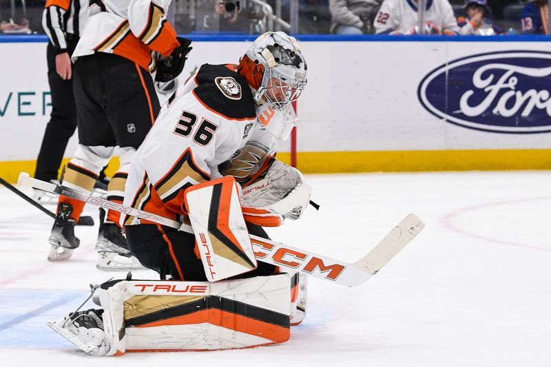 Dec 13, 2023; Elmont, New York, USA; Anaheim Ducks goaltender John Gibson (36) makes a save against the New York Islanders during the second period at UBS Arena. Mandatory Credit: Dennis Schneidler-USA TODAY Sports