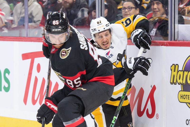 Dec 14, 2024; Ottawa, Ontario, CAN; Ottawa Senators defenseman Jake Sanderson (85) battles with Pittsburgh Penguins right wing Rickard Rakell (67) in the second period at the Canadian Tire Centre. Mandatory Credit: Marc DesRosiers-Imagn Images