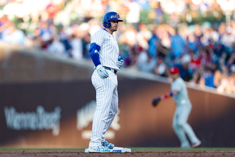 Jul 3, 2024; Chicago, Illinois, USA; Chicago Cubs outfielder Ian Happ (8) reacts after hitting a double against the Philadelphia Phillies during the second inning at Wrigley Field. Mandatory Credit: Kamil Krzaczynski-USA TODAY Sports