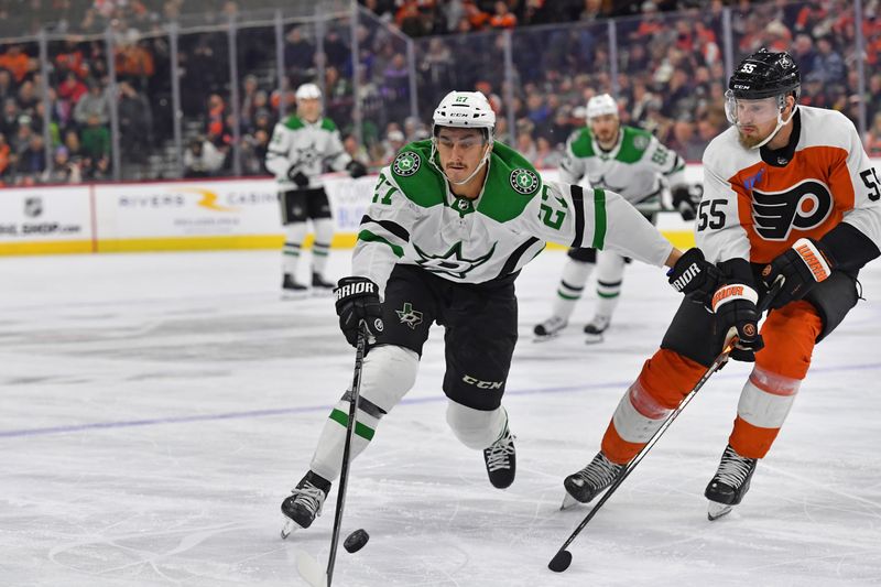 Jan 18, 2024; Philadelphia, Pennsylvania, USA;  Dallas Stars left wing Mason Marchment (27) and Philadelphia Flyers defenseman Rasmus Ristolainen (55) battle for the puck during the second period at Wells Fargo Center. Mandatory Credit: Eric Hartline-USA TODAY Sports