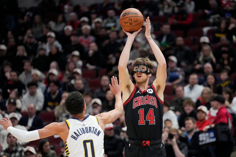 CHICAGO, ILLINOIS - DECEMBER 06: Matas Buzelis #14 of the Chicago Bulls shoots the ball against Tyrese Haliburton #0 of the Indiana Pacers during the first quarter of a game at the United Center on December 06, 2024 in Chicago, Illinois. NOTE TO USER: User expressly acknowledges and agrees that, by downloading and or using this photograph, User is consenting to the terms and conditions of the Getty Images License Agreement. (Photo by Patrick McDermott/Getty Images)