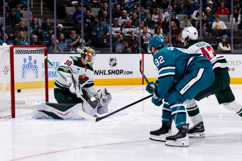 Dec 31, 2025; San Jose, California, USA;  San Jose Sharks left wing Igor Chernyshov (92) shoots and scores against Minnesota Wild goaltender Jesper Wallstedt (30) during the second period at SAP Center at San Jose. Mandatory Credit: John Hefti-Imagn Images
