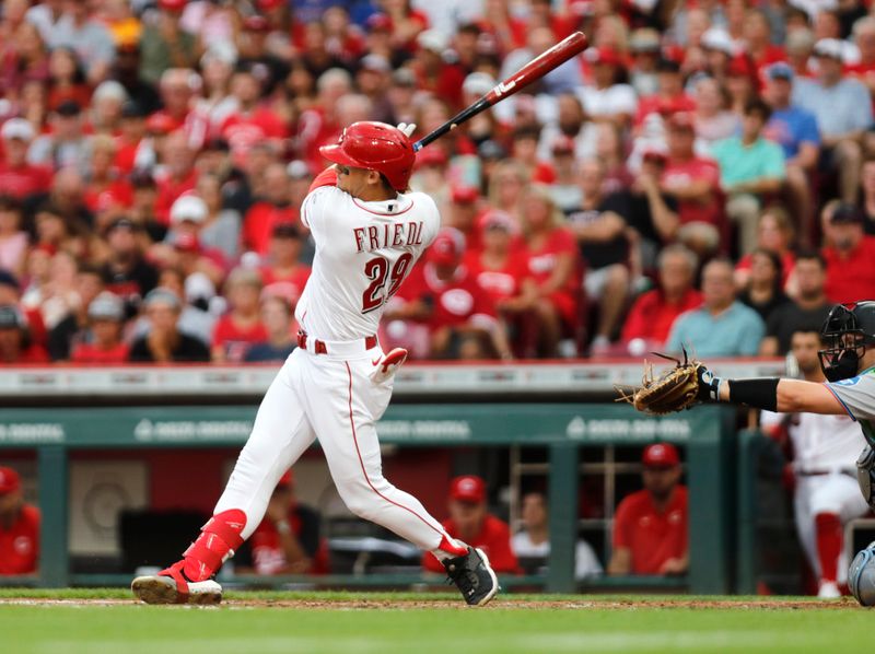 Aug 7, 2023; Cincinnati, Ohio, USA; Cincinnati Reds center fielder TJ Friedl (29) hits a two-run triple against the Miami Marlins during the third inning at Great American Ball Park. Mandatory Credit: David Kohl-USA TODAY Sports