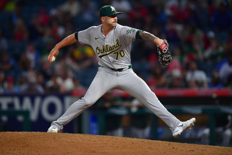 Jul 26, 2024; Anaheim, California, USA;Oakland Athletics pitcher Lucas Erceg (70) throws against the Los Angeles Angelsduring the ninth inning at Angel Stadium. Mandatory Credit: Gary A. Vasquez-USA TODAY Sports