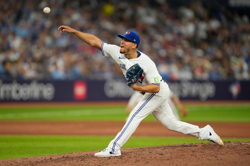 Jul 19, 2023; Toronto, Ontario, CAN; Toronto Blue Jays starting pitcher Jose Berrios (17) pitches to the San Diego Padres during the fifth inning at Rogers Centre. Mandatory Credit: John E. Sokolowski-USA TODAY Sports