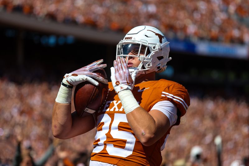 Oct 7, 2023; Dallas, Texas, USA;  Texas Longhorns tight end Gunnar Helm (85) catches a touchdown pass during the game against the Oklahoma Sooners at the Cotton Bowl. Mandatory Credit: Kevin Jairaj-USA TODAY Sports
