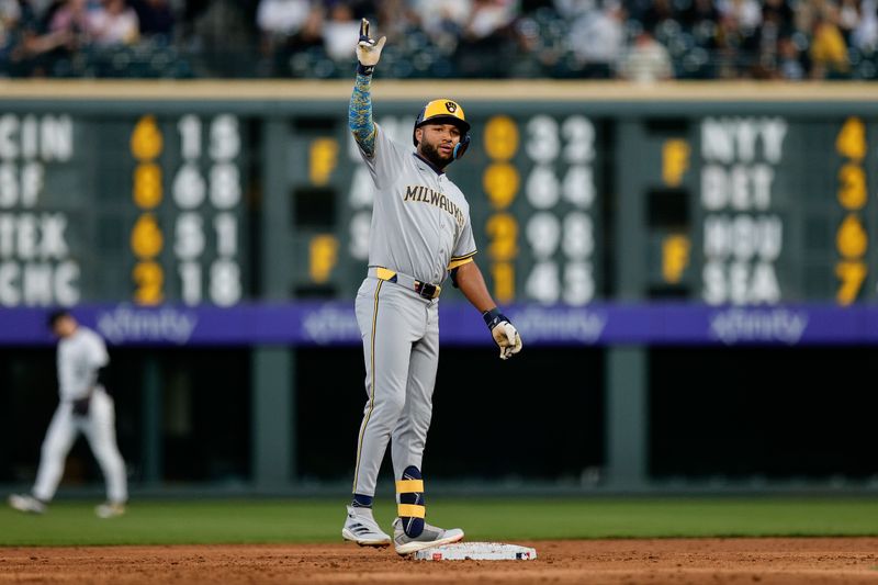 Apr 9, 2025; Denver, Colorado, USA; Milwaukee Brewers left fielder Jackson Chourio (11) reacts from second on an RBI double in the third inning against the Colorado Rockies at Coors Field. Mandatory Credit: Isaiah J. Downing-Imagn Images