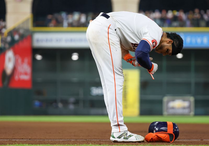 May 18, 2024; Houston, Texas, USA; Houston Astros shortstop Jeremy Pena (3) removes his batting equipment after grounding out leaving men in scoring position against the Milwaukee Brewers to end the eighth inning at Minute Maid Park. Mandatory Credit: Thomas Shea-USA TODAY Sports