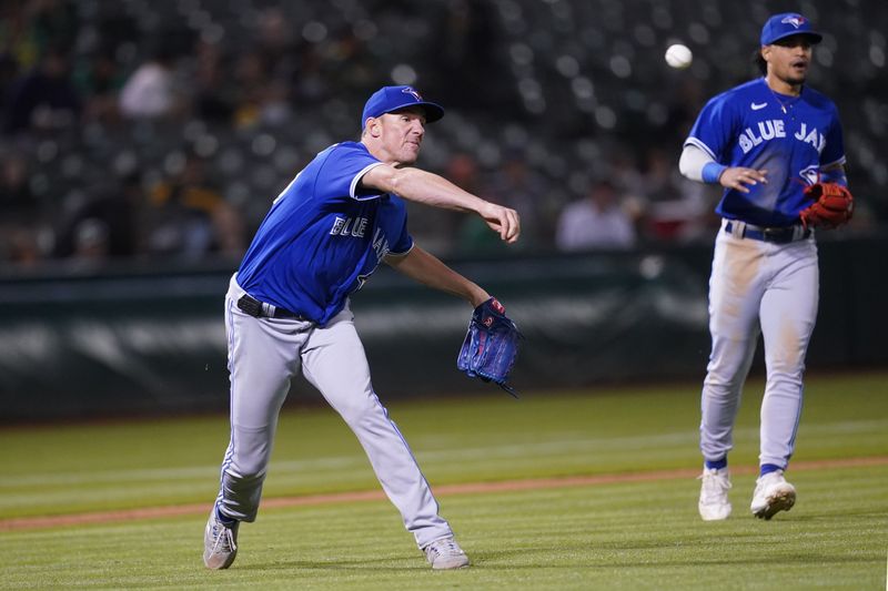 Sep 5, 2023; Oakland, California, USA; Toronto Blue Jays pitcher Chris Bassitt (40) throws the ball to first to record an out against the Oakland Athletics in the sixth inning at Oakland-Alameda County Coliseum. Mandatory Credit: Cary Edmondson-USA TODAY Sports