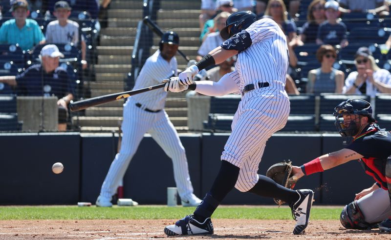 Feb 26, 2023; Tampa, Florida, USA; New York Yankees center fielder Aaron Judge (99) singles during the first inning against the Atlanta Braves at George M. Steinbrenner Field. Mandatory Credit: Kim Klement-USA TODAY Sports